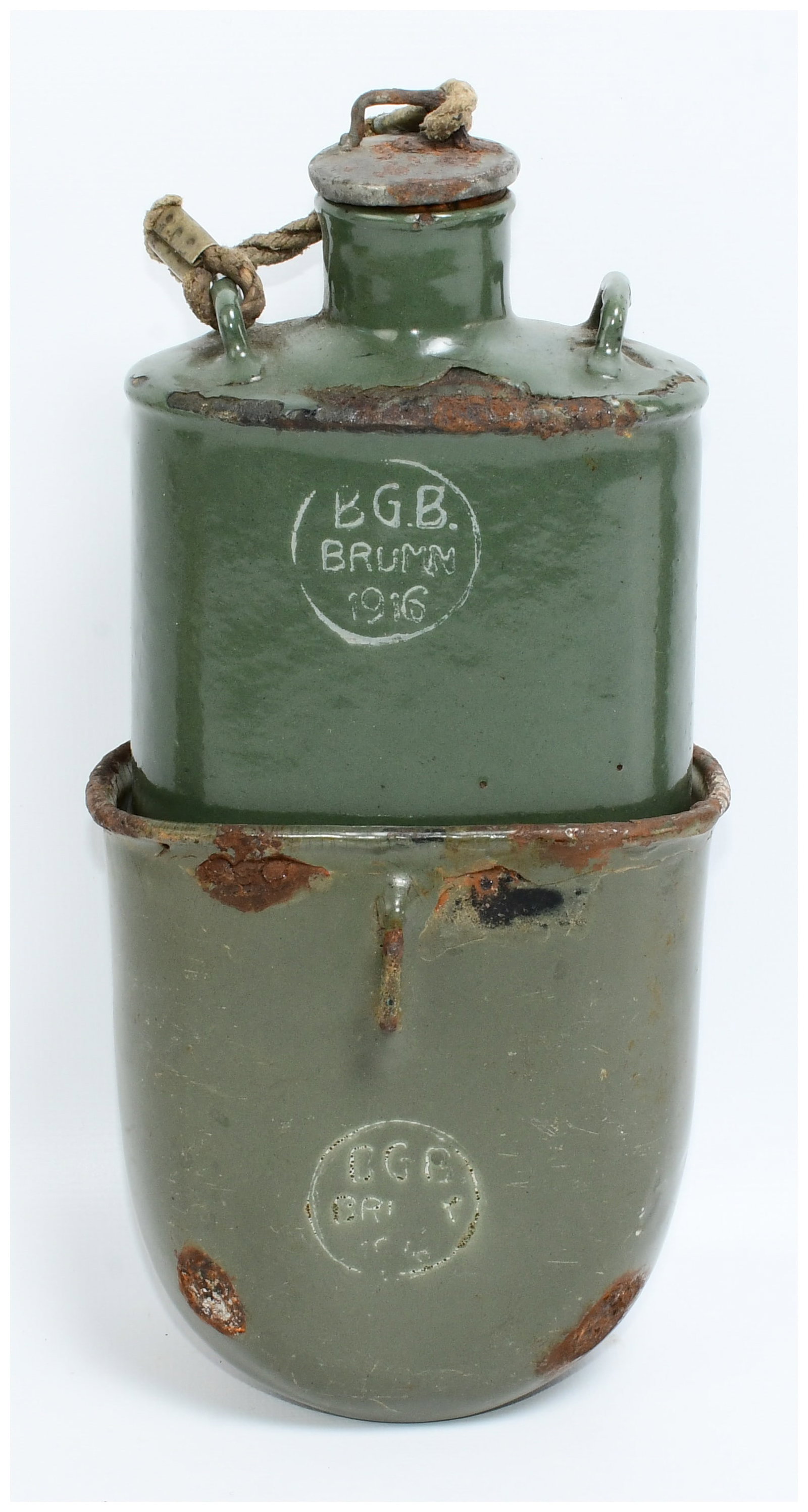 Austro-Hungarian WWI B.G.B. Brumm 1916 Enamel Steel Military Canteen with Nesting Cup: An Austro-Hungarian WWI B.G.B. Brumm 1916 enamel steel military canteen with its nesting cup. Constructed from enameled steel in a drab green finish. The canteen features an embossed circular cartouch