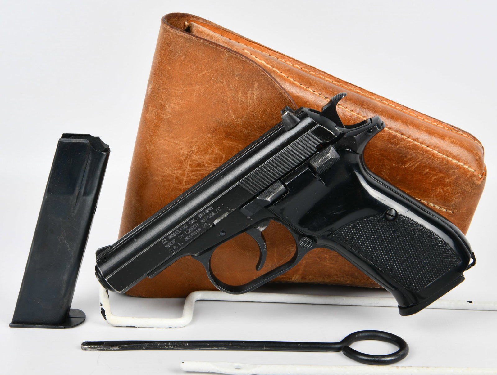 CZ Model 82 Semi-Automatic Pistol, 9x18mm, Imported by C.A.I. Georgia VT., with Holster and: A CZ Model 82 semi-automatic pistol, chambered in 9x18mm. The pistol features a black finish and checkered synthetic grip panels. Visible markings on the slide include "CZ MODEL:82 CAL. 9X18MM", "MADE