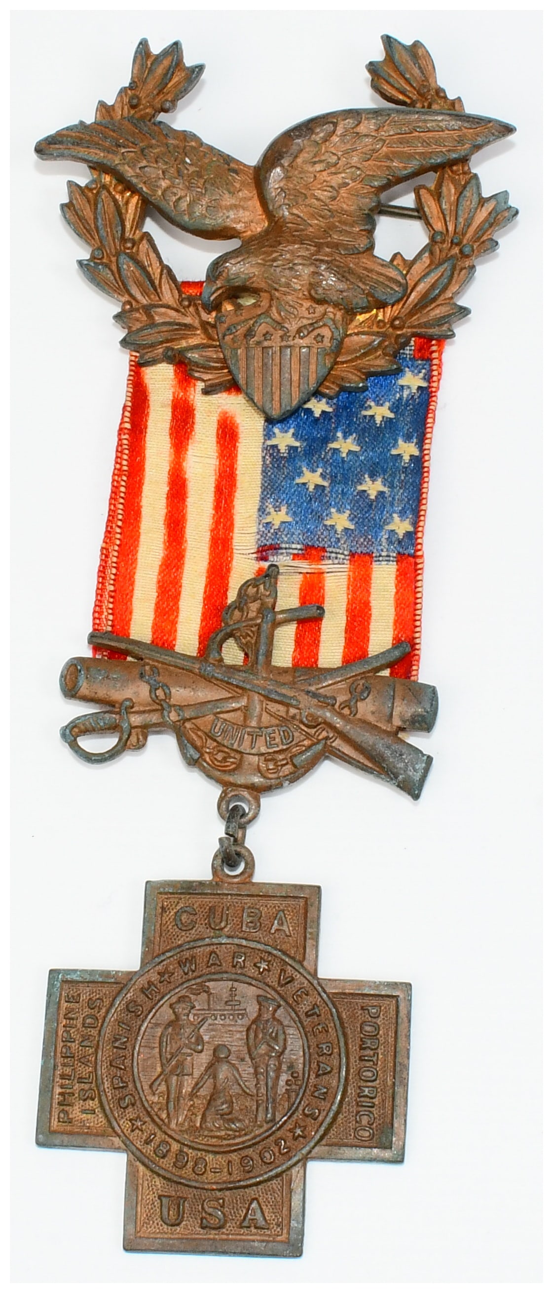 A United Spanish War Veterans Numbered Commemorative Medal, 1898-1902: A United Spanish War Veterans Numbered Commemorative Medal, dating to the late 19th or early 20th century. The medal is constructed from a patinated bronze or copper alloy and a fabric ribbon. The top