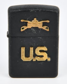 A Zippo US Military Lighter with Crossed Swords and "U.S." Emblems