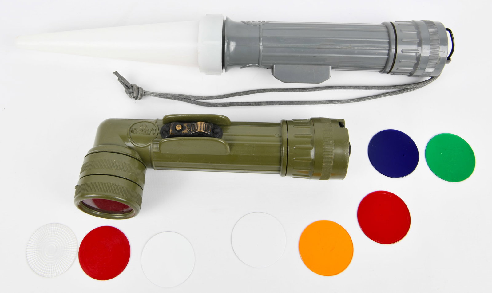 A Pair of Fulton MX-991/U U.S. Military Angle Head Flashlights, Vietnam Era: A pair of Fulton MX-991/U U.S. military angle head flashlights, dating to the Vietnam Era. One flashlight is olive green and marked "U.S." while the other is grey and marked "MADE IN U.S.A.". Both uni