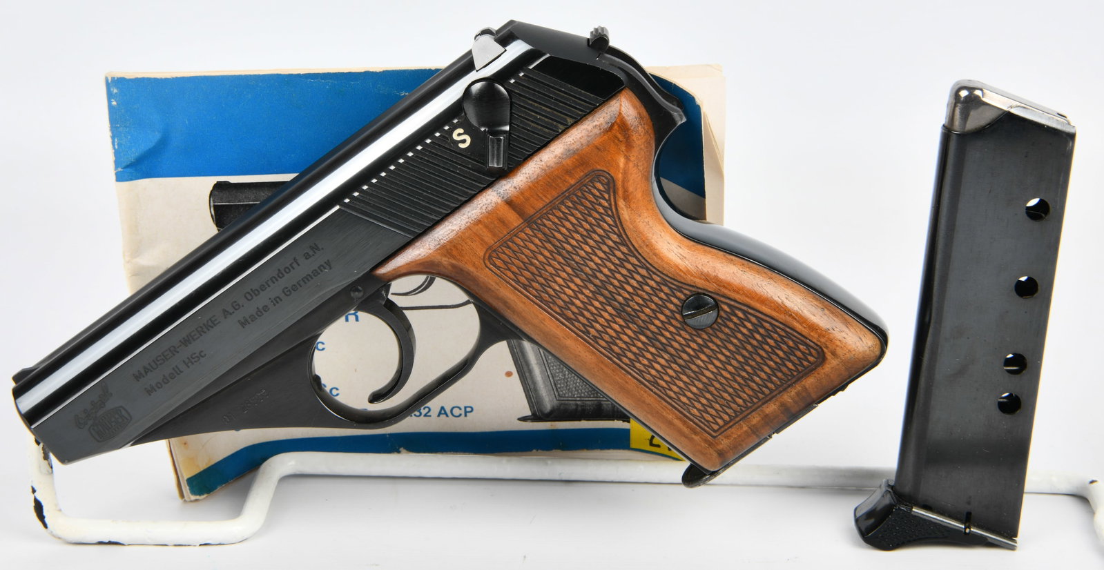 Boxed Mauser HSc Semi-Automatic Pistol by Interarms, .380 ACP: A Mauser HSc semi-automatic pistol, imported by Interarms, chambered in .380 ACP. The pistol is crafted from blued steel with finely checkered walnut grip panels. The left side of the slide is marked 