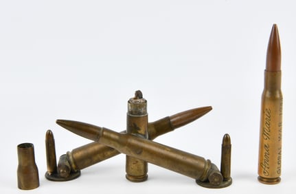 An Assemblage of World War II Trench Art, including a Lighter and Inscribed Cartridge