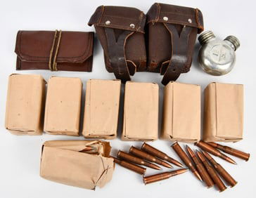 A Collection of Vintage Mosin Nagant 7.62x54r Ammunition, Pouches, and Oil Can