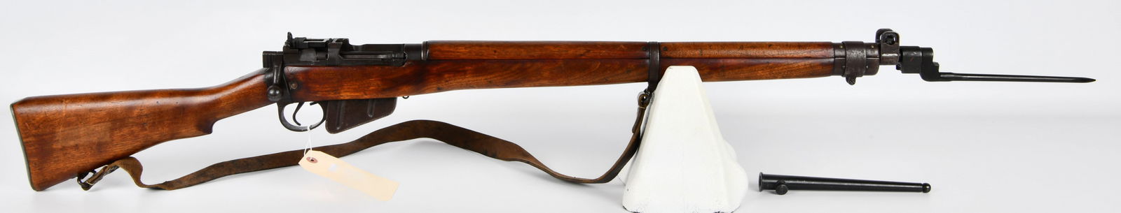 Lee-Enfield No. 4 Mk I* .303 British Bolt-Action Rifle with U.S. Property Markings and Bayonet: A Lee-Enfield No. 4 Mk I* .303 British bolt-action military rifle. The rifle features a full-length wooden stock and handguard with blued steel metal components. Key markings on the receiver include "