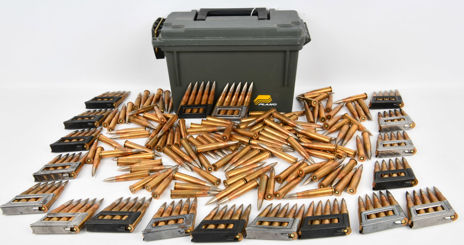 A Collection of Vintage Soviet 1939 7.62x54R Rifle Cartridges with Plano Ammunition Can: A collection of vintage Soviet 7.62x54R rifle cartridges, dating to 1939 manufacture. The lot comprises approximately 200-300 rounds, featuring brass-cased cartridges with distinctive silver-tipped pr