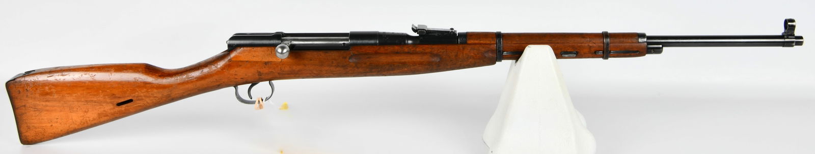 Polish WZ-48 .22LR Bolt Action Training Rifle: A Polish WZ-48 .22LR bolt action training rifle, consistent with military-style firearms. This rifle features a wooden stock and blued steel components. Visible markings on the receiver include the se