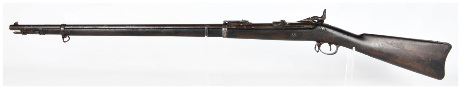 U.S. Model 1884 Springfield Trapdoor Rifle, Serial No. 353856, Antique: An antique U.S. military longarm firearm, identified as a U.S. Model 1884 Springfield Trapdoor Rifle. This breech-loading, single-shot rifle features an external hammer and is constructed from dark st