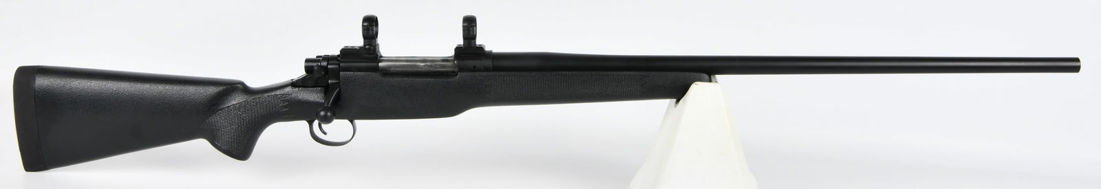 Remington 03-A3 Sporter Bolt-Action Rifle, .30-338 Win Mag: A Remington 03-A3 Sporter bolt-action rifle, chambered in .30-338 Win Mag. This modern rifle features a black synthetic stock with textured grip panels and a "BELL & CARLSON" marked buttpad. The barre