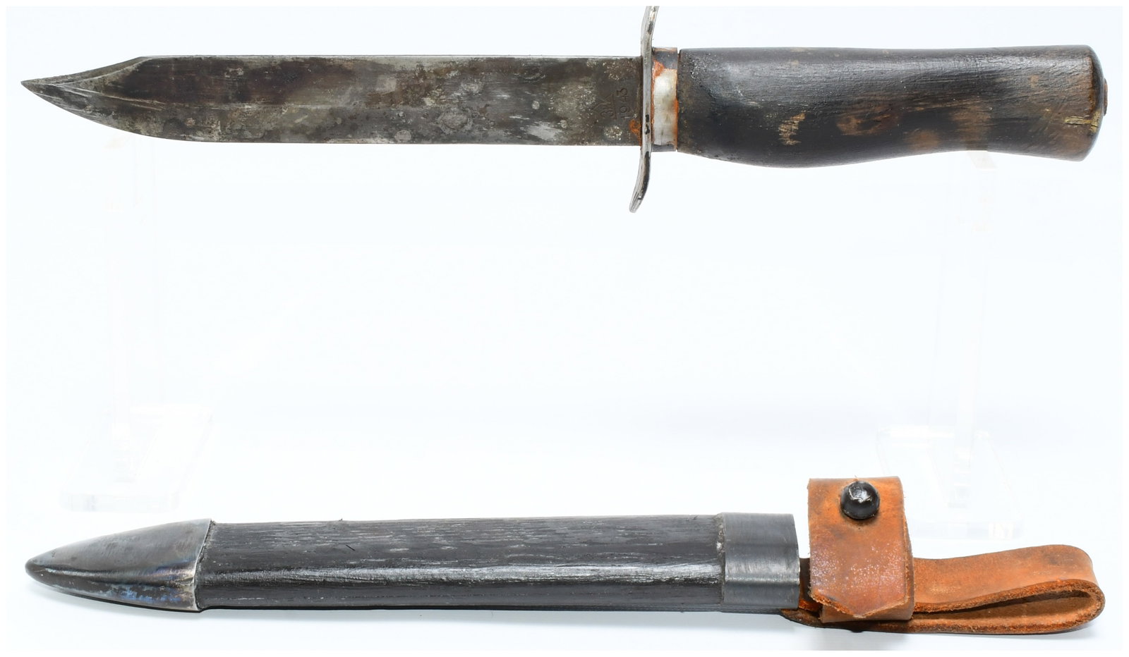 Soviet ZIK 1943 NR-40 Scout's Knife with Scabbard: A Soviet ZIK 1943 NR-40 Scout's Knife, comprising a fixed-blade military-style knife with its accompanying scabbard. The knife features a broad metal blade with a subtle false edge, a simple S-shaped 