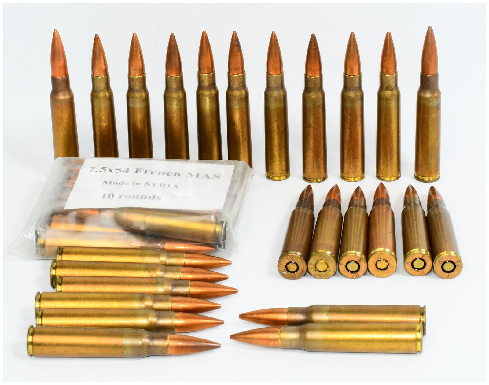 35 Rounds 7.5x54 French MAS Rifle Ammunition, Made in Syria: This lot comprises 35 rounds of 7.5x54 French MAS rifle ammunition. The cartridges feature brass casings and copper-jacketed projectiles. One sealed clear plastic bag contains 10 rounds, explicitly la