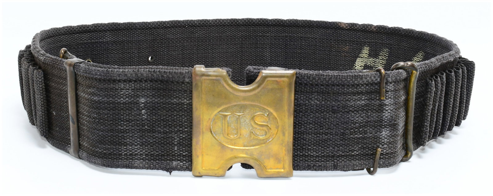 US Model 1886 Mills Cartridge Belt for the .45-70: A US Model 1886 Mills Cartridge Belt for the .45-70 caliber. This dark, woven fabric cartridge belt features a brass buckle embossed with "US" within an oval. It includes numerous individual loops des