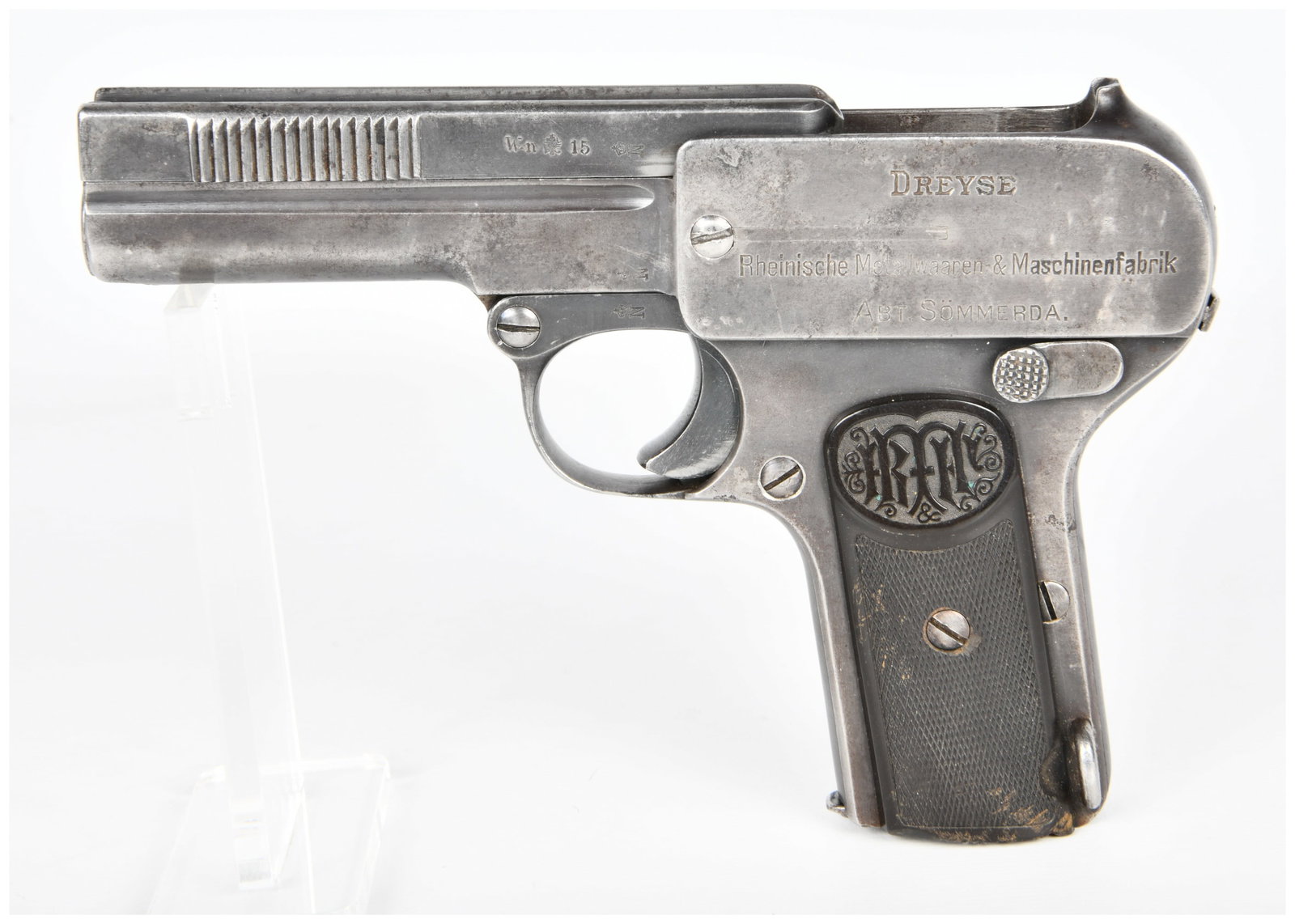 Dreyse Model 1907 Semi-Automatic Pistol, .32 ACP, dated 1915: A Dreyse Model 1907 Semi-Automatic Pistol, chambered in .32 ACP (7.65mm Browning), dating to the early 20th century. The pistol is predominantly constructed of blued steel with dark, checkered grip pa