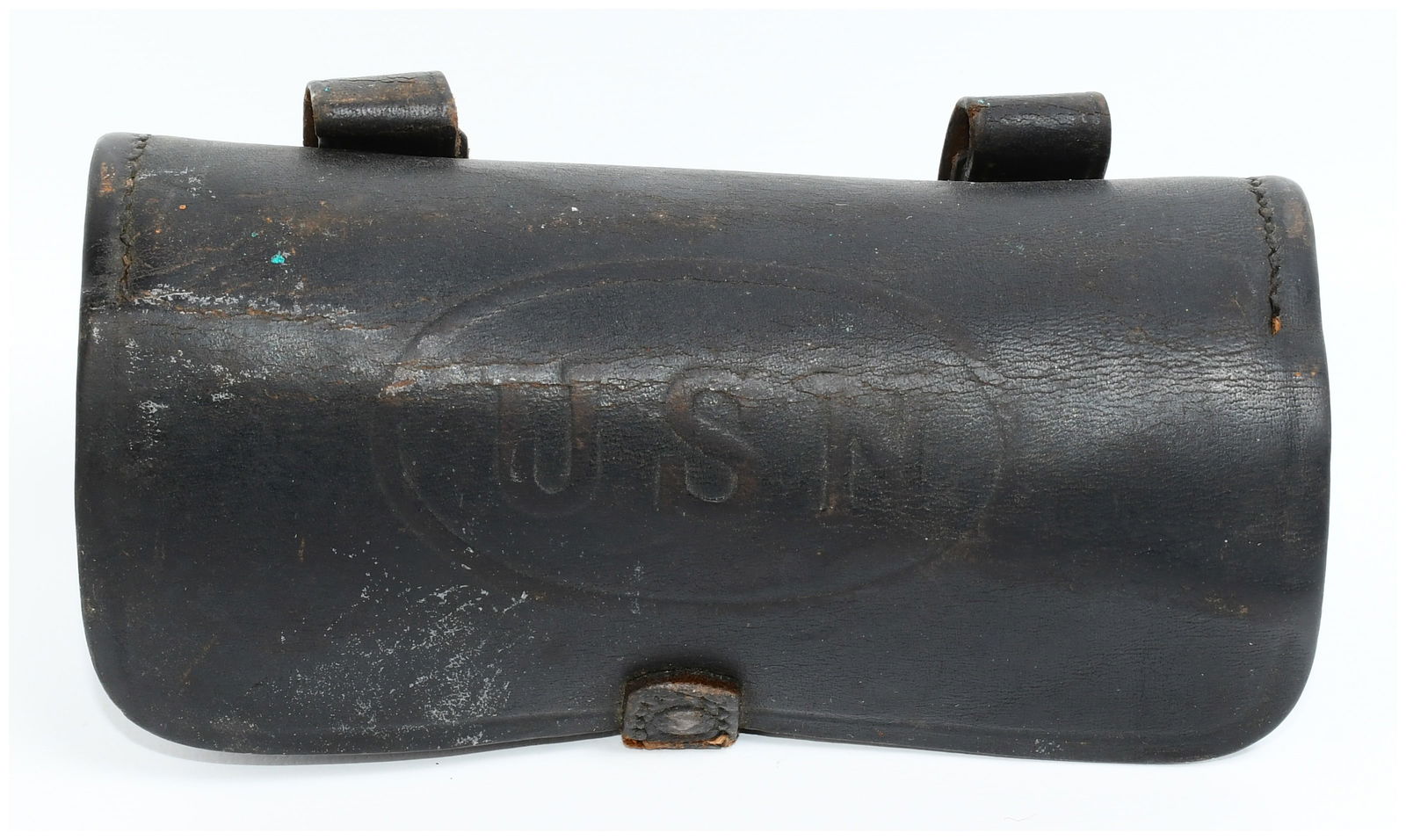 U.S. Navy Model 1889 Colt Revolver .38 Caliber Cartridge Box, Spanish-American War Era: A U.S. Navy Model 1889 Colt Revolver .38 Caliber Cartridge Box, dating to the Spanish-American War era. This utilitarian dark leather military pouch features a curved rectangular body with a hinged fl