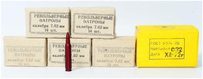 70 Rounds of 7.62mm Revolver Cartridges and 40 Empty Brass Casings for Reloading, with a Dummy Round