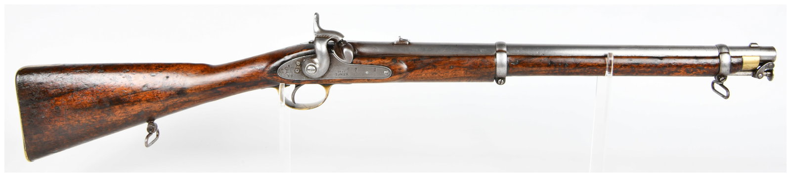 British Pattern 1856 Percussion Cavalry Carbine, Dated 1857: An antique British Pattern 1856 Percussion Cavalry Carbine. This British military pattern carbine, dating to the mid-19th century, features a dark-grained wooden stock paired with patinated steel/iron