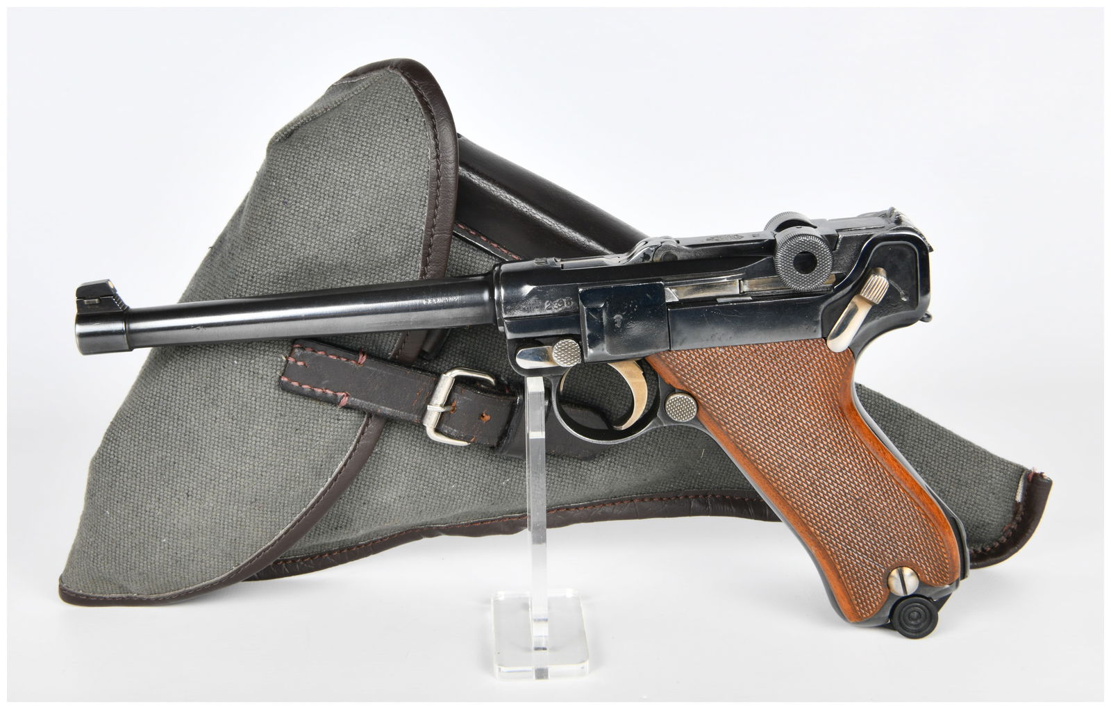 A DWM 1920 Commercial Artillery Luger Semi-Automatic Pistol with Holster and Modern Magazine: A vintage DWM 1920 Commercial Artillery Luger semi-automatic pistol, Chambered in .30 Luger, featuring a toggle-lock action, constructed primarily of blued steel with bright metal components and a bra