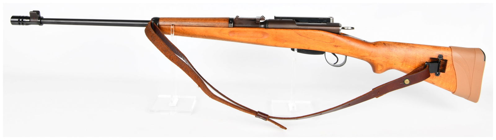 Swiss K31 Bolt-Action Rifle, Serial No. 537052: A Swiss K31 Bolt-Action Rifle of military-style design, featuring a light-colored wooden stock, a dark blued metal barrel, and a matching receiver. The receiver is marked with the serial number "53705