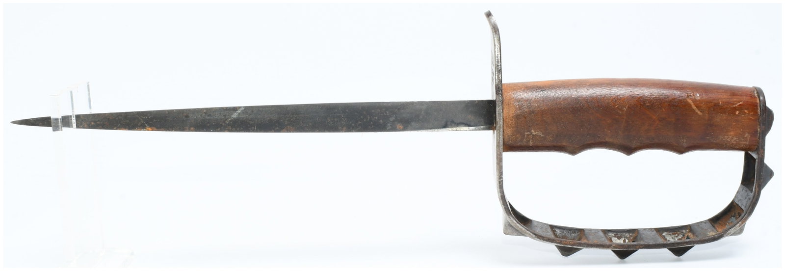 Original US WWI M1917 Trench Knife by L.F.&C.: An original US WWI M1917 Trench Knife by L.F.&C. This military-style trench knife features a double-edged, tapering metal blade and a wooden handle shaped with finger grooves. The distinctive metal D-