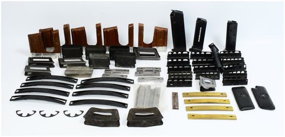 A Collection of Various Stripper Clips, Half Moon Clips, Magazines, and Grips, including Swedish