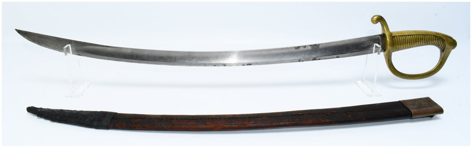 19th Century French Napoleonic Infantry Briquet Sabre with Scabbard, P. Knecht Solingen: A 19th Century French Napoleonic Infantry Briquet Sabre featuring a curved steel blade and a brass D-guard hilt with a ribbed grip. The blade is etched with decorative scrollwork on one side. The reve