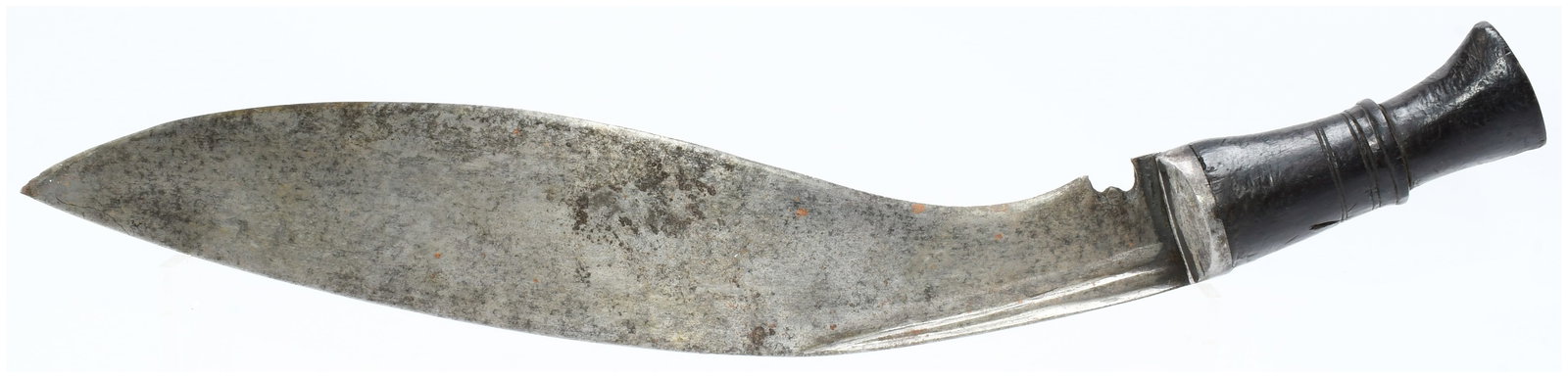 Antique Nepalese Gurkha Kukri Fighting Knife: An Antique Nepalese Gurkha Kukri Fighting Knife, characterized by its distinctive inwardly curved, heavy steel blade and a dark, likely wooden, handle with a flared pommel and metal bolster. Engraved 