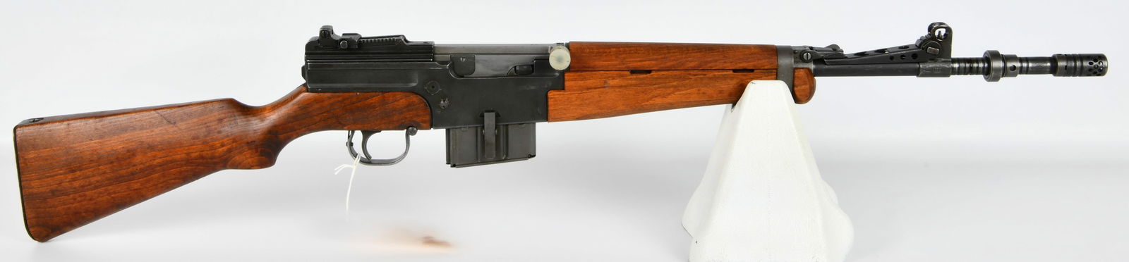 French MAS Mle 1949-56 Semi-Automatic Rifle, 7.5mm French: A French MAS Mle 1949-56 semi-automatic rifle, identified by its markings and consistent with common examples of this model. The rifle features a dark finished steel construction paired with a reddish