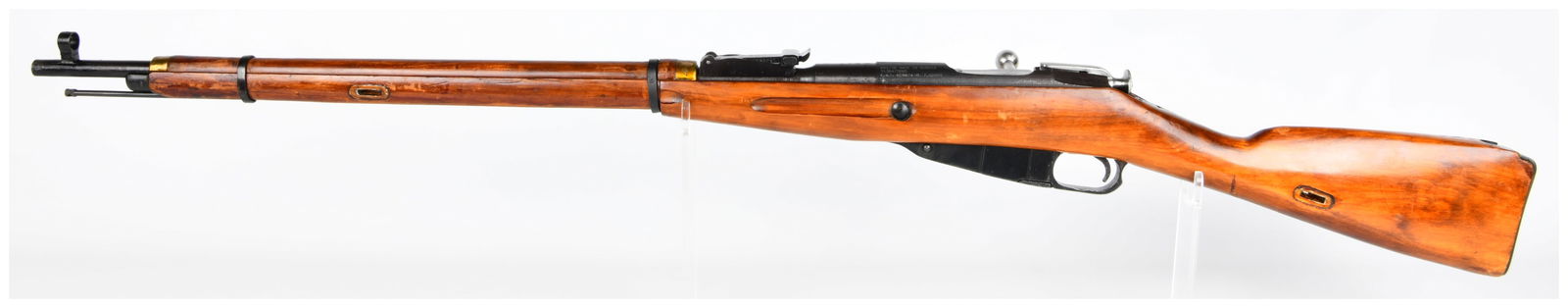 Russian Mosin Nagant M91/30 Bolt-Action Rifle, Izhevsk, Dated 1943: A Russian Mosin Nagant M91/30 bolt-action rifle, constructed with a wooden stock and blued and bright steel components. The receiver is explicitly marked "M91/30 MADE IN RUSSIA" and bears a "1943" dat
