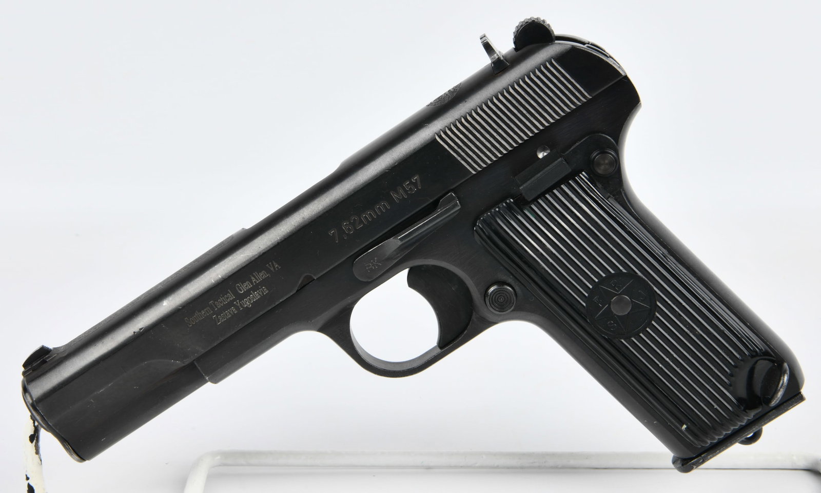 Yugoslavian Zastava M57 Tokarev 7.62x25mm Semi-Automatic Pistol: A Yugoslavian Zastava M57 Tokarev semi-automatic pistol, chambered in 7.62x25mm. The pistol is constructed of black blued steel. Visible markings on the slide include "7.62mm M57", "Southern Tactical 