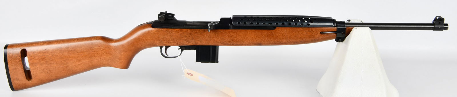 Plainfield Machine M1 Semi-Automatic Carbine, .30 Caliber: A Plainfield Machine M1 Semi-Automatic Carbine, chambered in .30 caliber. This commercial M1 Carbine clone features a light-colored wooden stock and blued metal components, including a perforated hand