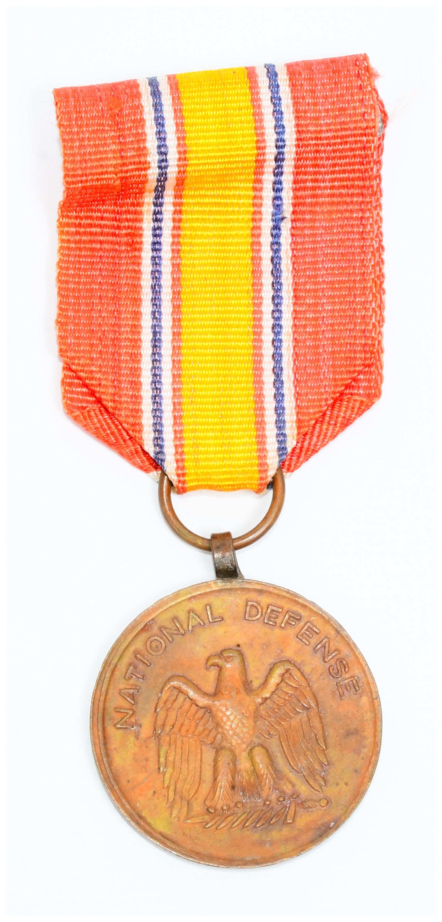 National Defense Service Medal, Vietnamese-made: A National Defense Service Medal, identified by web intelligence as Vietnamese-made. This circular, bronze-toned military service medal is suspended from a folded fabric ribbon. The obverse features a