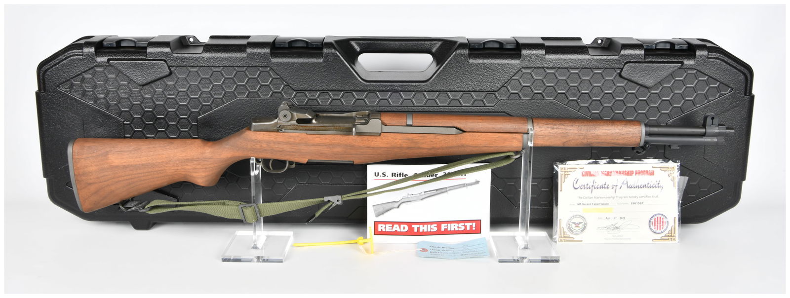 Springfield M1 Garand Expert Grade Rifle, CMP Certified: A Springfield M1 Garand Expert Grade Rifle, U.S. Rifle, Caliber .30, M1. The rifle features a wooden stock and handguards, with blued and parkerized metal components, and an attached olive drab canvas