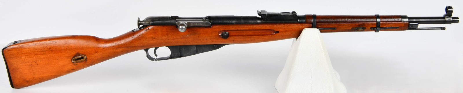 Russian Mosin-Nagant M91/59 Bolt-Action Carbine, Dated 1943, 7.62x54R: A Russian Mosin-Nagant M91/59 bolt-action carbine, dated 1943. This military rifle is constructed from blued steel with a reddish-brown wooden stock, featuring an external magazine, adjustable iron si