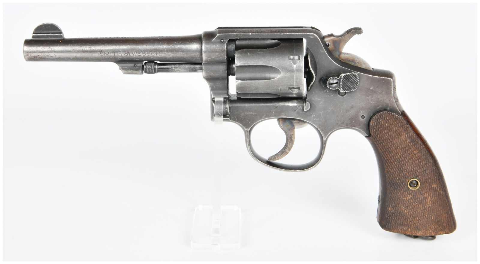 Smith & Wesson .38 S&W Military & Police 'United States Property' Double-Action Revolver: A Smith & Wesson .38 S&W Military & Police 'United States Property' double-action revolver, crafted from blued steel with checkered wooden grip panels. The barrel is marked "SMITH & WESSON SPRINGFIELD