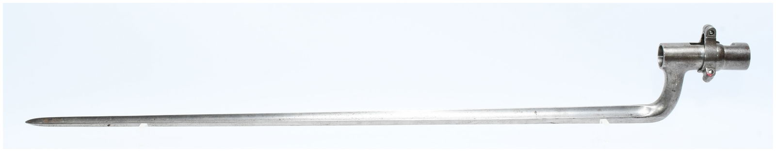 Late 19th / Early 20th Century Japanese Military Issue Steel Socket Bayonet: A well-used steel socket bayonet, consistent with military issue from the late 19th or early 20th century. It features a cruciform profile blade tapering to a blunt point, an angled elbow, and a cylin