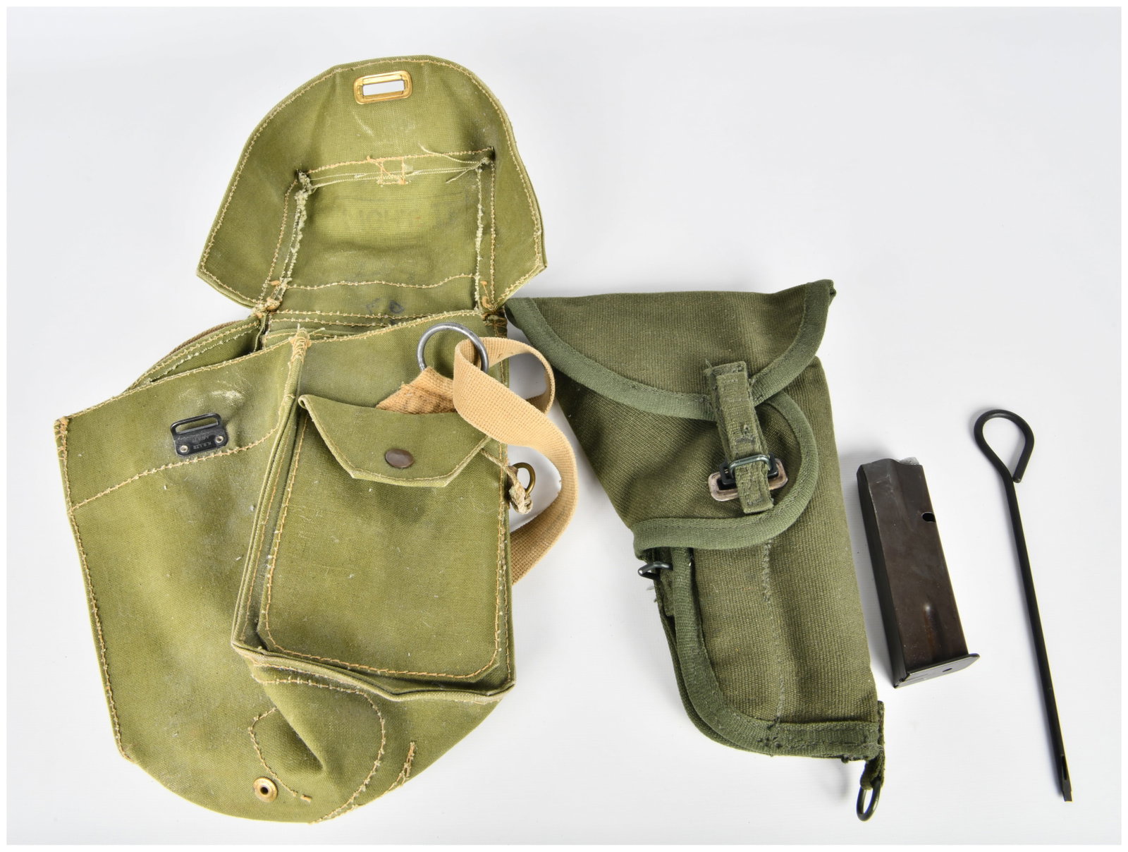 A Group of WWII Era Military Field Gear, including a Canvas Gas Mask Style Utility Bag with 'DRGM': This lot comprises a collection of military-style field gear. The central piece is a large olive green canvas utility bag, visually consistent with World War II era gas mask carriers. It features a ma