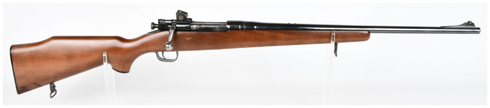 U.S. Smith-Corona Model 03-A3 Sporter Bolt-Action Rifle: A U.S. Smith-Corona Model 03-A3 Sporter bolt-action rifle, featuring a blued steel barrel, receiver, and operating components. The rifle is set within a dark reddish-brown wooden stock and equipped wi