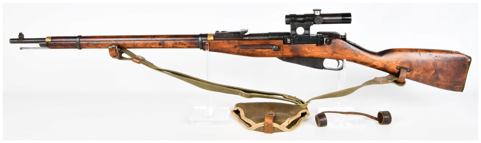 Soviet Mosin Nagant 91/30 PU Sniper Rifle, Dated 1942: A Soviet Mosin Nagant 91/30 PU Sniper Rifle, a bolt-action military rifle dating to the mid-20th century, specifically marked "1942" on the barrel shank, indicative of World War II era production. Con