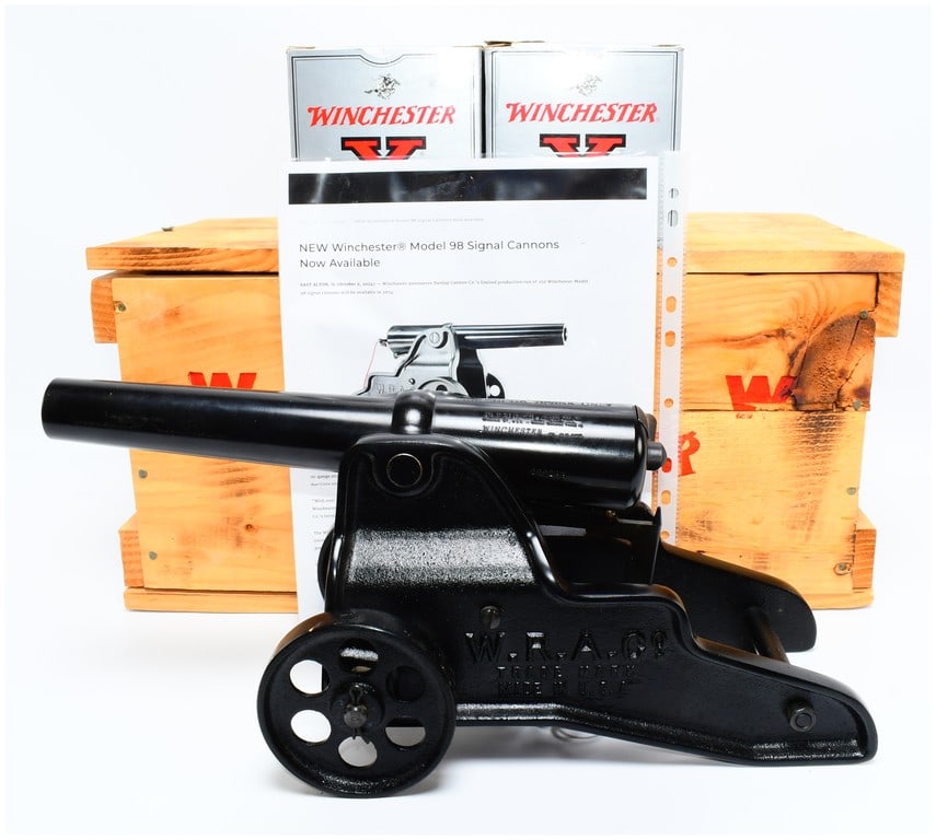 Win Model 98 Signal Cannon Reproduction with 2 Boxes of 10 Gauge Blank Shotshells in Original Crate: A contemporary reproduction Winchester Model 98 signal cannon, based on a design first debuted in 1903, constructed from black-finished blued steel and cast-iron. Visible markings on the cannon includ