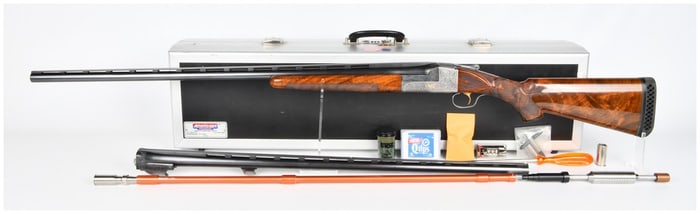 An Ithaca Gun Co. Engraved Skeet Shotgun 12 Gauge Two Barrel Set, one 34" barrel and one 32" barrel.