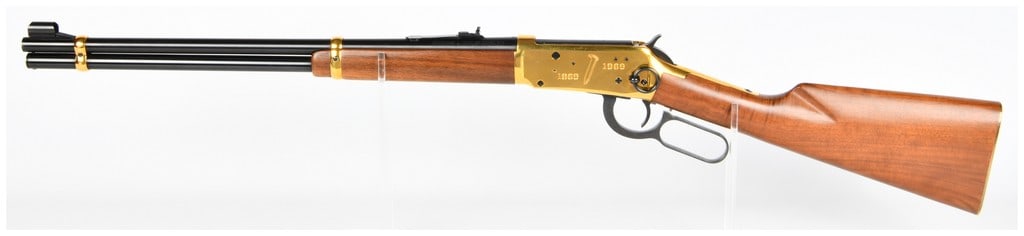 Win Model 94 Golden Spike Commemorative 30-30 Win Lever-Action Rifle 20" Barrel Serial Number: A Winchester Model 94 Golden Spike Commemorative 30-30 Win lever-action rifle. The rifle features a blued steel 20" barrel, gold-plated receiver and barrel bands, and a figured wooden stock and forend