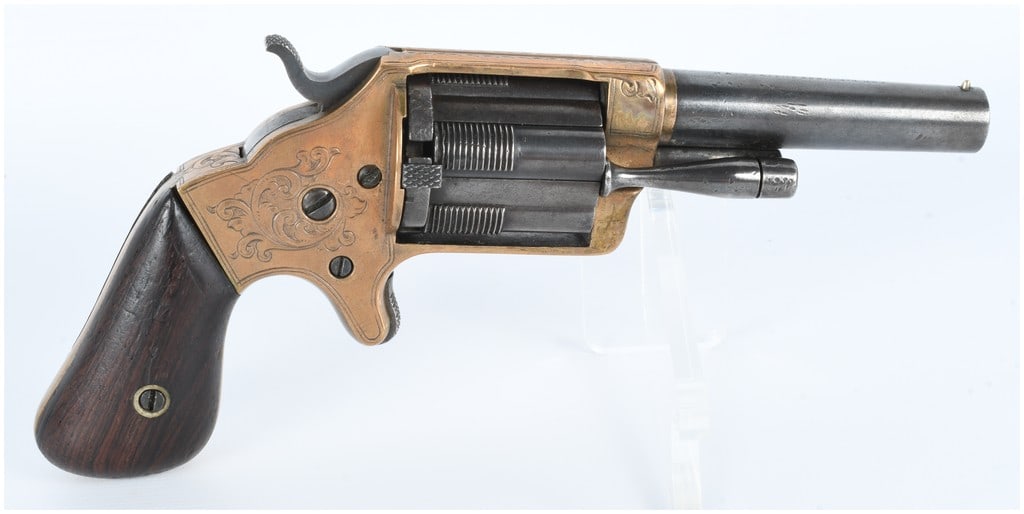 Brooklyn Arms Co. Slocum Patent .32 Cal Pocket Revolver dated April 14th 1863: A Brooklyn Arms Co. Slocum Patent .32 caliber pocket revolver, dated April 14th, 1863. This antique firearm features a brass or bronze open-top frame, intricately adorned with scrollwork engraving on