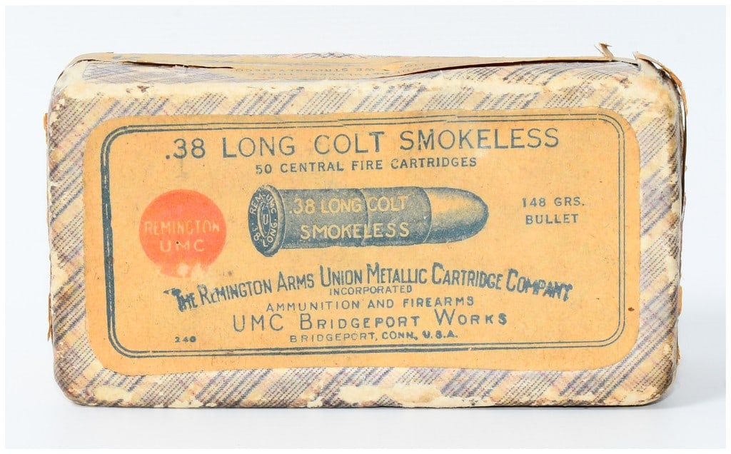 Vintage Box of 50 Rounds Rem UMC .38 Long Colt Smokeless Ammo: A vintage rectangular cardboard box of Remington UMC .38 Long Colt Smokeless ammunition, containing 50 central fire cartridges. The exterior labels, printed in English, clearly state ".38 LONG COLT SM