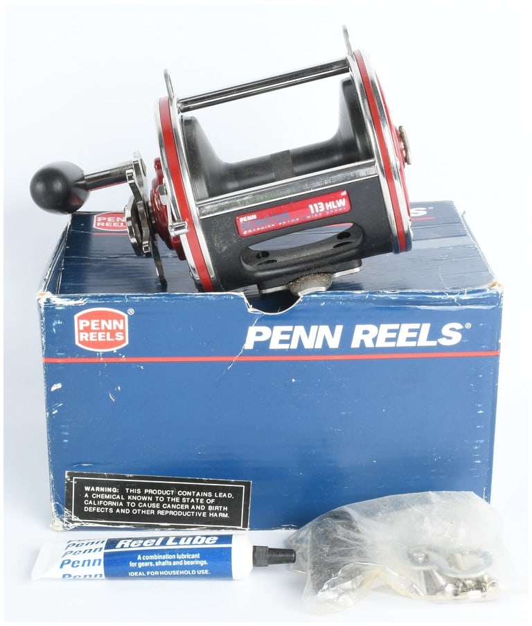Penn Senator 113HLW Special 4/0 High Speed Conventional Fishing Reel with Box and Accessories Ammo: A Penn Senator 113HLW Special 4/0 High Speed Conventional Fishing Reel. This reel features a black graphite composite frame, red side plates, chrome-plated metal accents, and a black handle knob. Prom