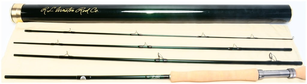 R.L. Winston Rod Co. AIR SALT 9' 10wt. 4-Piece Fly Fishing Rod: A R.L. Winston Rod Co. AIR SALT 9' 10wt. 4-Piece Fly Fishing Rod. This lot comprises a multi-piece fly fishing rod, presented disassembled into four dark green sections. It features a natural cork han