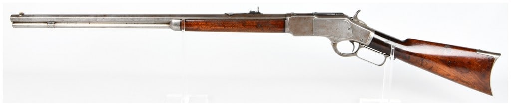 Win Model 1873 Special Order Lever-Action Repeating Rifle .32 WCF Serial No. 244524B: A Winchester Model 1873 Special Order Lever-Action Repeating Rifle, constructed from steel with a wooden stock and forend. The upper tang is marked "MODEL 1873". The barrel bears the inscription "WINC