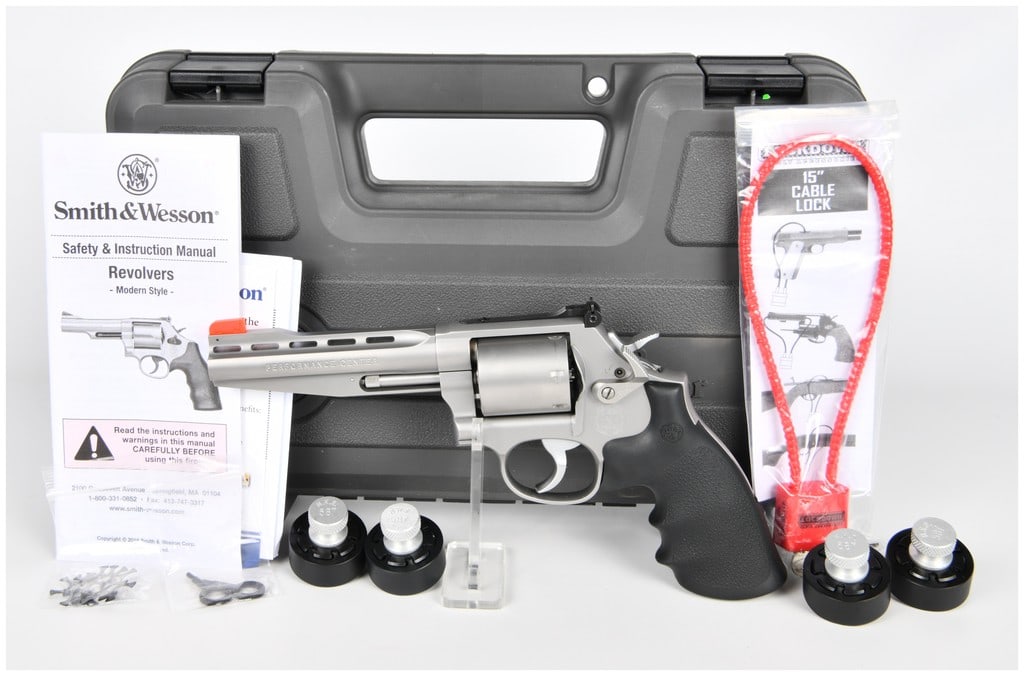 Smith & Wesson Performance Center Model 686-6 Plus .357 Mag Revolver with 5-inch Vented Barrel and 4: A modern Smith & Wesson Performance Center Model 686-6 Plus revolver chambered in .357 Magnum, featuring a five-inch vented barrel and constructed from stainless steel with a textured black rubber gri
