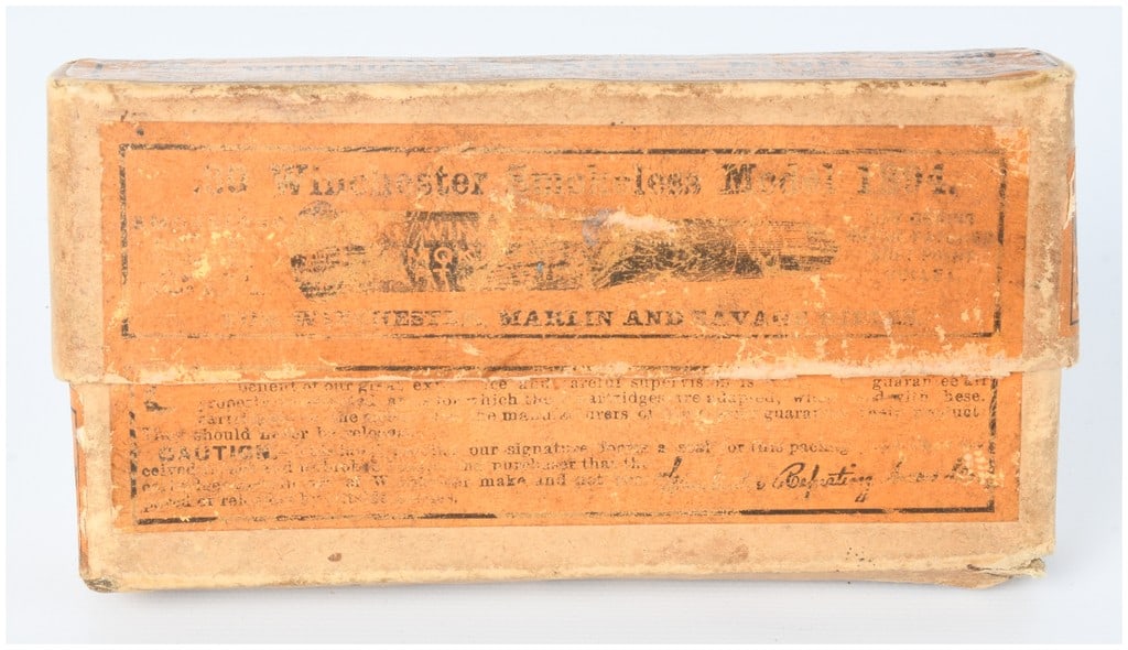 Vintage Win .30 Cal Model 1894 Ammo Box with 8 Live Rounds: A partially filled, vintage cardboard ammunition box, originally for 20 rounds of .30 Winchester Caliber Model 1894 Smokeless Soft Point cartridges, manufactured by the Winchester Repeating Arms Co., 