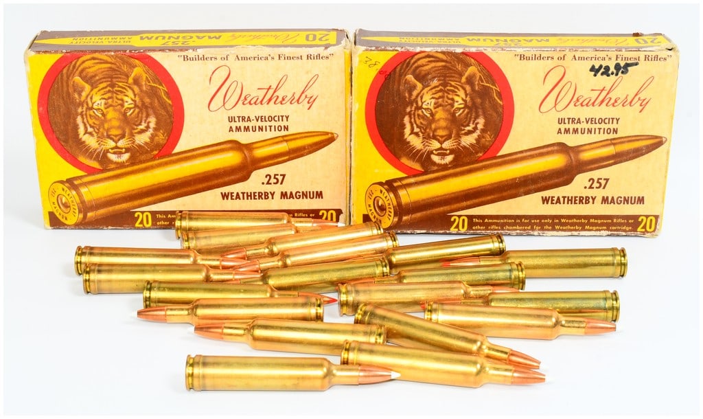 Wby .257 Wby Mag Ultra-Velocity Ammo with Vintage Tiger Graphic Boxes 52 Rounds: A collection of Weatherby .257 Weatherby Magnum Ultra-Velocity Ammunition, presented with two vintage tiger graphic cardboard boxes. This lot comprises 52 ROUNDS of ammunition. The two yellow cardboar