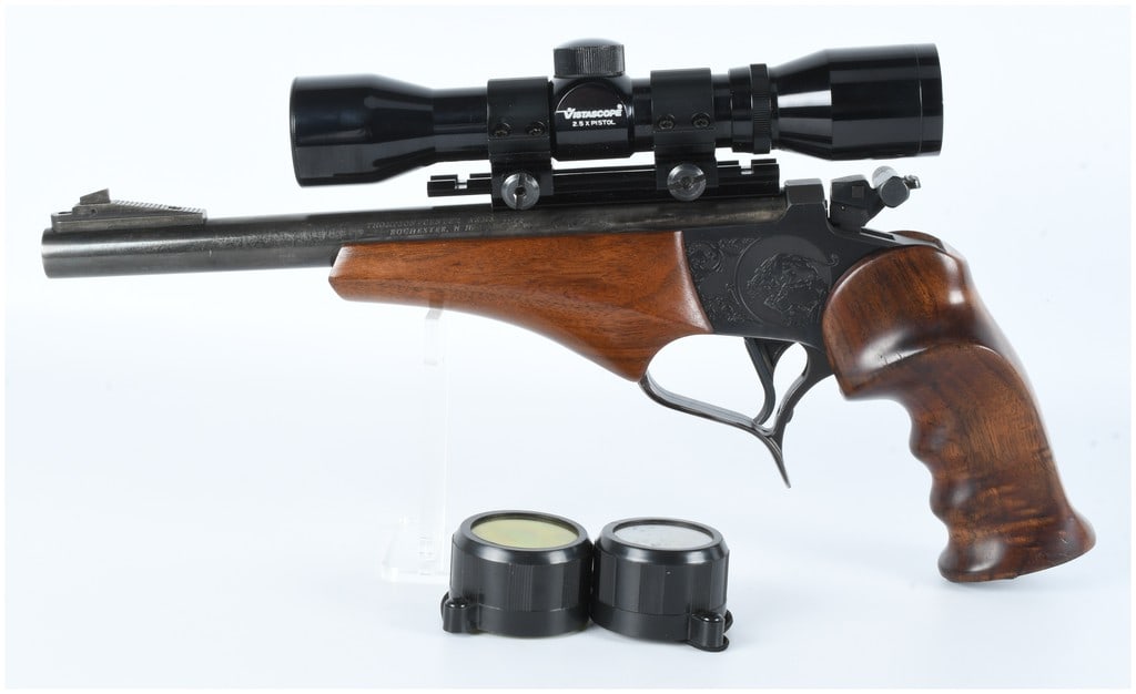 Thompson Center Contender .22LR Pistol with Vistascope 2.5X Pistol Scope: A Thompson Center Contender single-shot, break-action pistol, chambered in .22LR. The pistol features a blued metal finish on the barrel and frame, complemented by rich, dark brown wooden grips and a